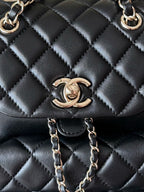 Chanel quilted leather bag front panel with double C emblem and gold chain