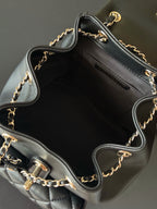 Chanel quilted leather mini bag open interior with chain shoulder strap