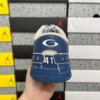 Blue sneaker back with white wing-like emblem and "41" marking