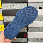 Blue sneaker outsole with patterned tread and embossed design