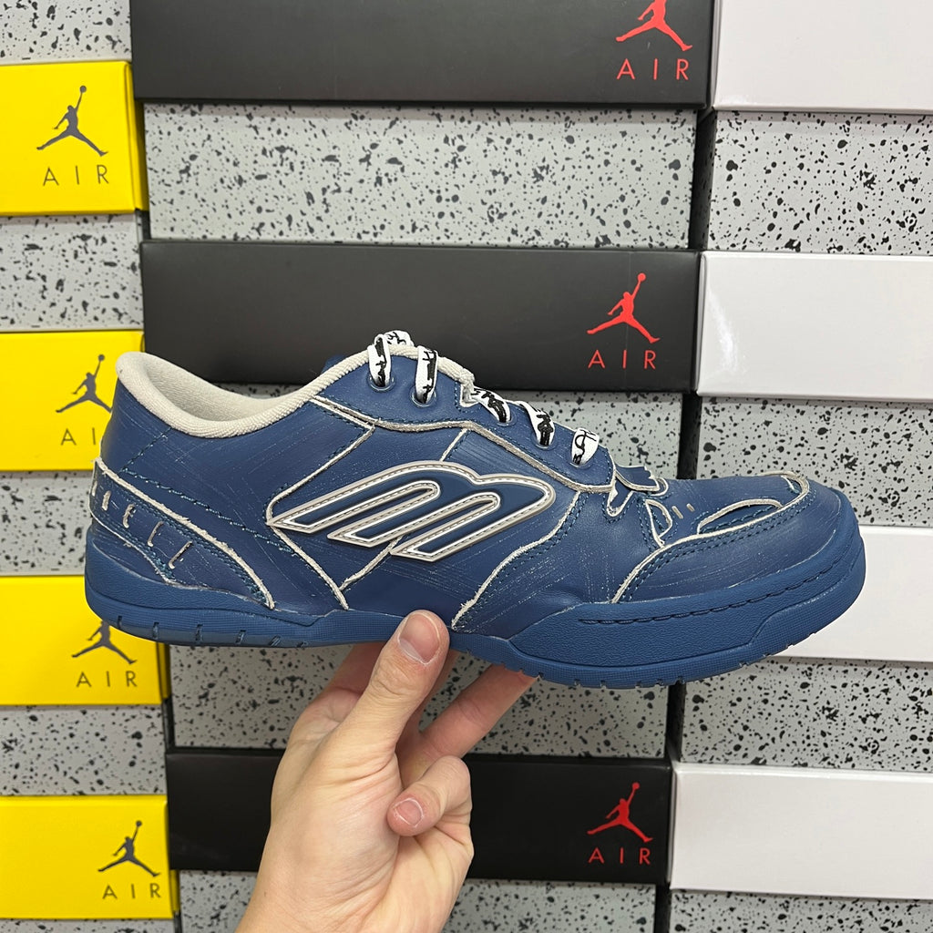 Blue unisex sneakers, angled side view with white logo and lace-up top