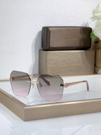 Bvlgari sunglasses with pink tinted gradient lenses and gold-tone metal frame