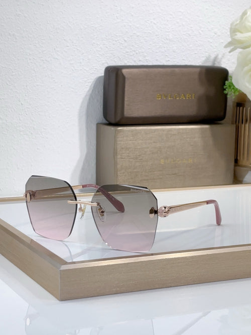Bvlgari sunglasses with pink tinted gradient lenses and gold-tone metal frame