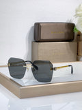 Bvlgari sunglasses with dark gray gradient lenses and gold-tone metal frame