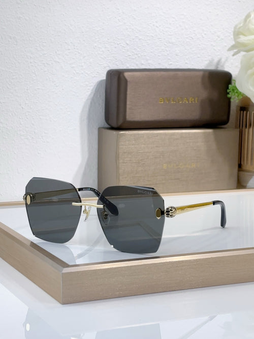 Bvlgari sunglasses with dark gray gradient lenses and gold-tone metal frame