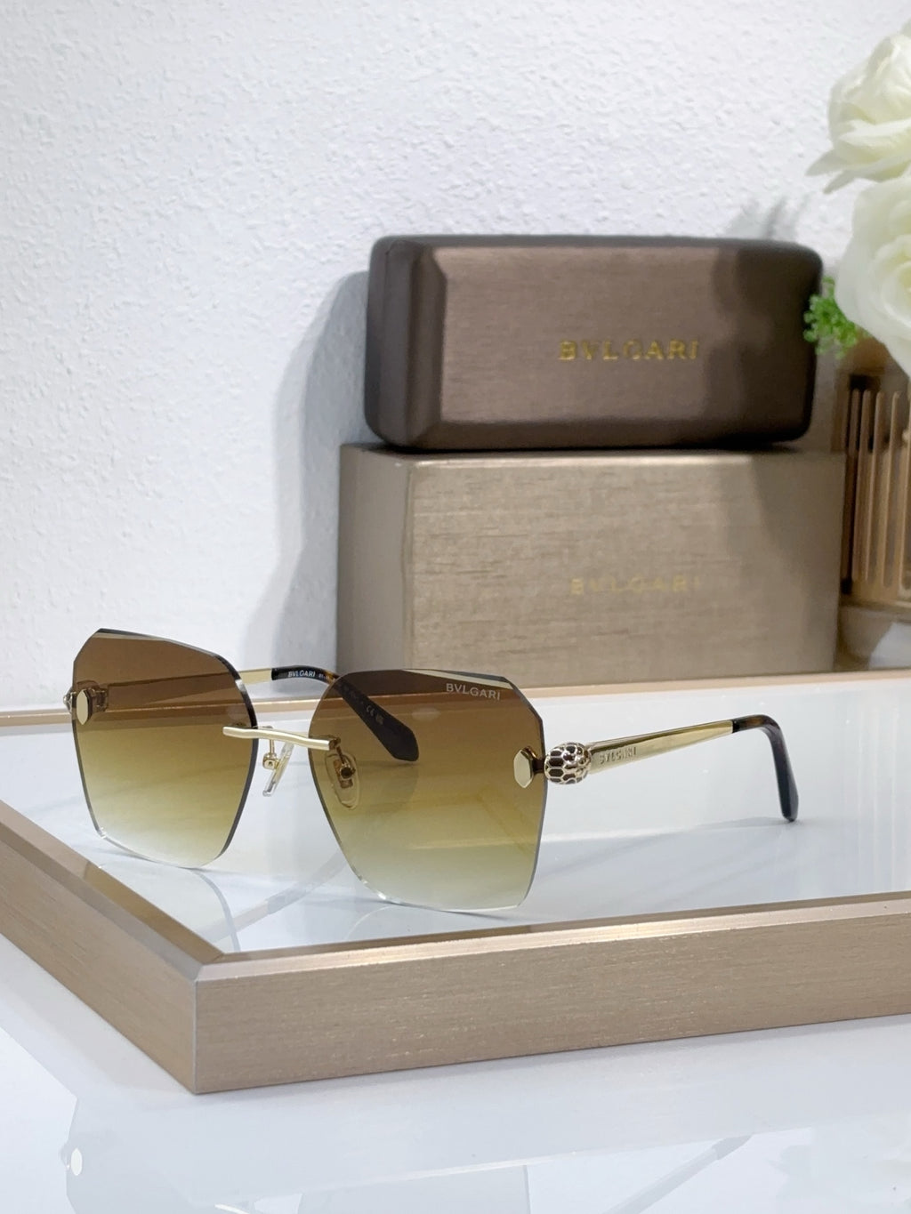 Bvlgari sunglasses with yellow-amber gradient lenses and gold-tone metal frame