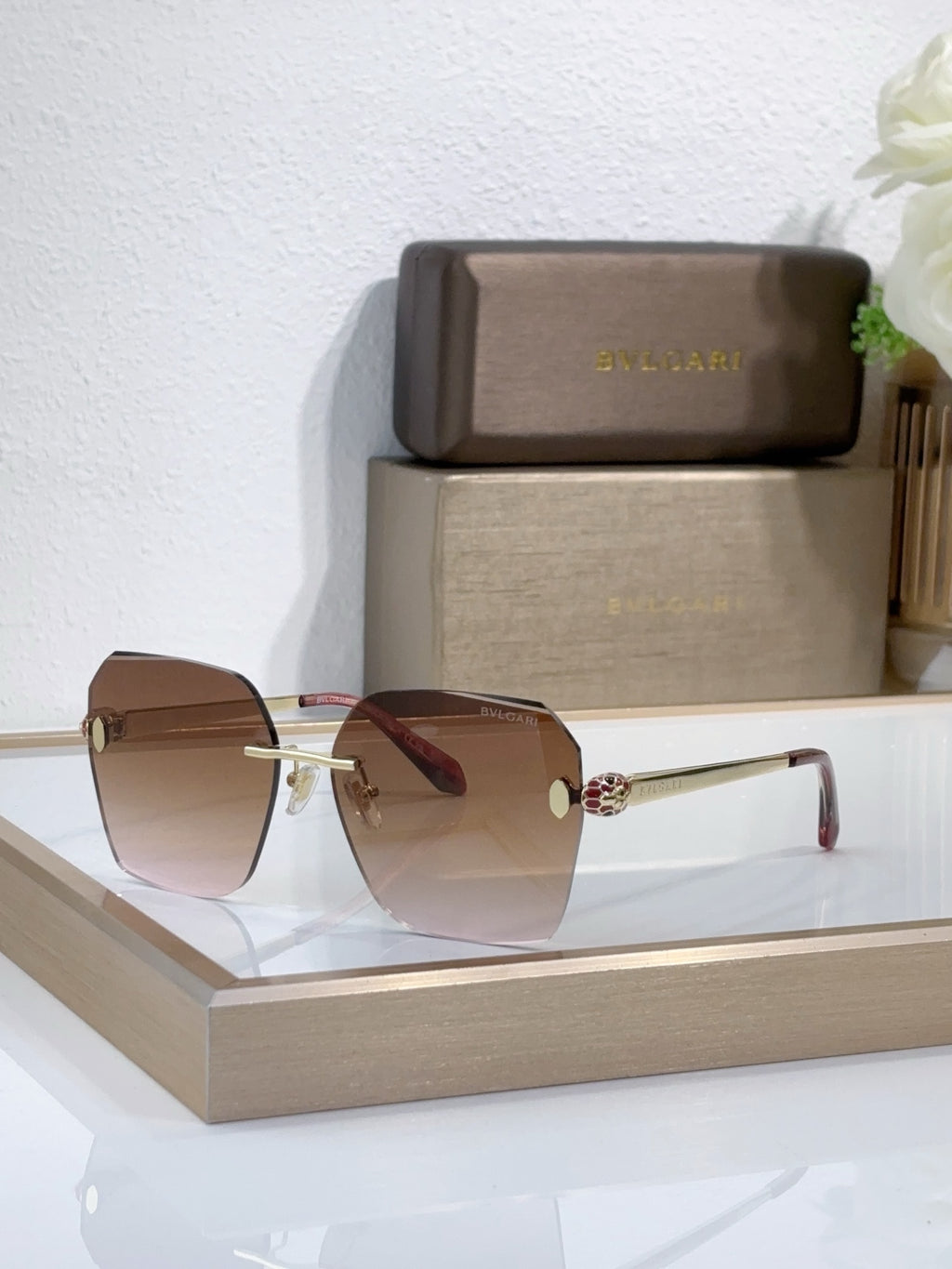 Bvlgari sunglasses with brown gradient lenses and gold-tone metal frame