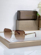 Bvlgari sunglasses with brown gradient lenses and gold-tone metal frame