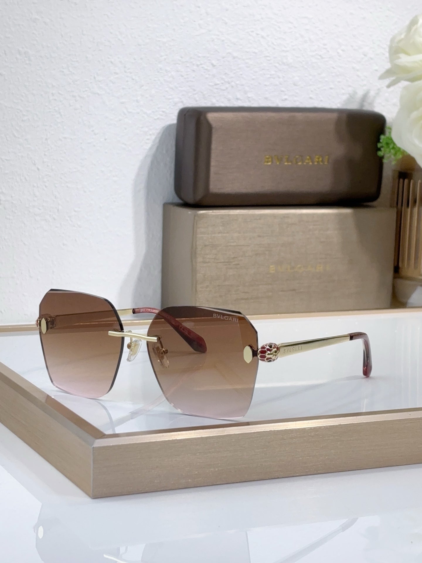 Bvlgari sunglasses with brown gradient lenses and gold-tone metal frame