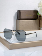 Bvlgari sunglasses with dark blue gradient lenses and gold-tone metal frame