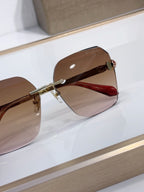 Bvlgari sunglasses with brown gradient lenses and red-toned temple arms