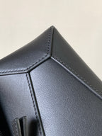 Loewe navy leather bag corner with triangular panel and contrast stitching