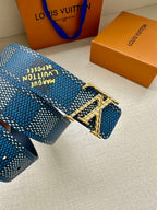 Blue patterned Louis Vuitton belt buckle detail with engraved silver hardware