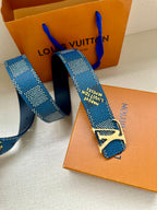 Louis Vuitton belt with blue check pattern and gold buckle, end with holes