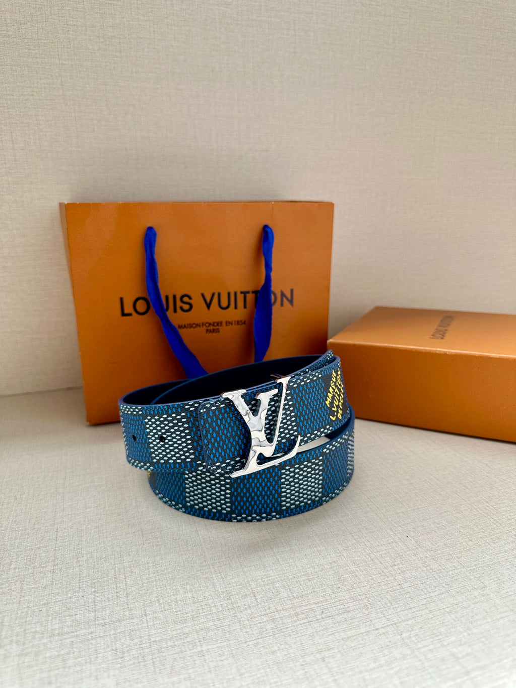 Louis Vuitton belt in blue check, gold-tone LV buckle front view