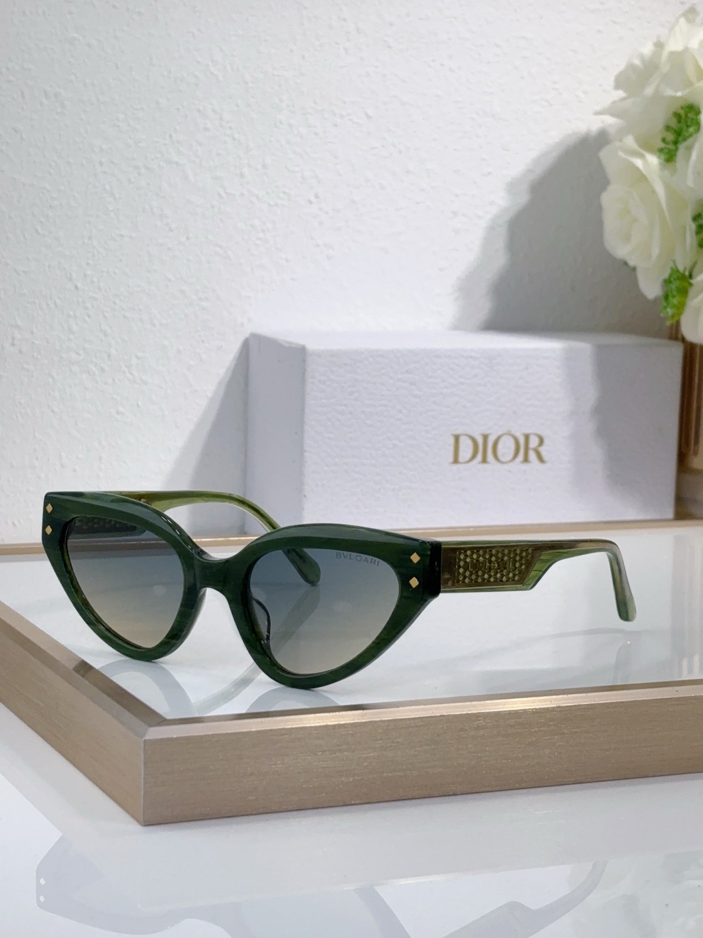 Bvlgari cat-eye sunglasses with green frames and dark lenses