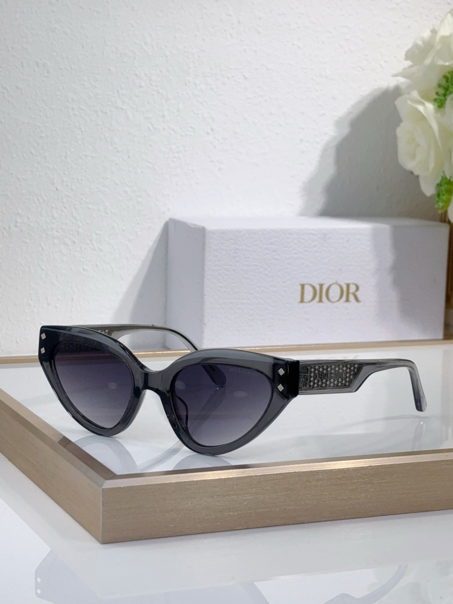 Bvlgari cat-eye sunglasses with black frames and patterned temple detail