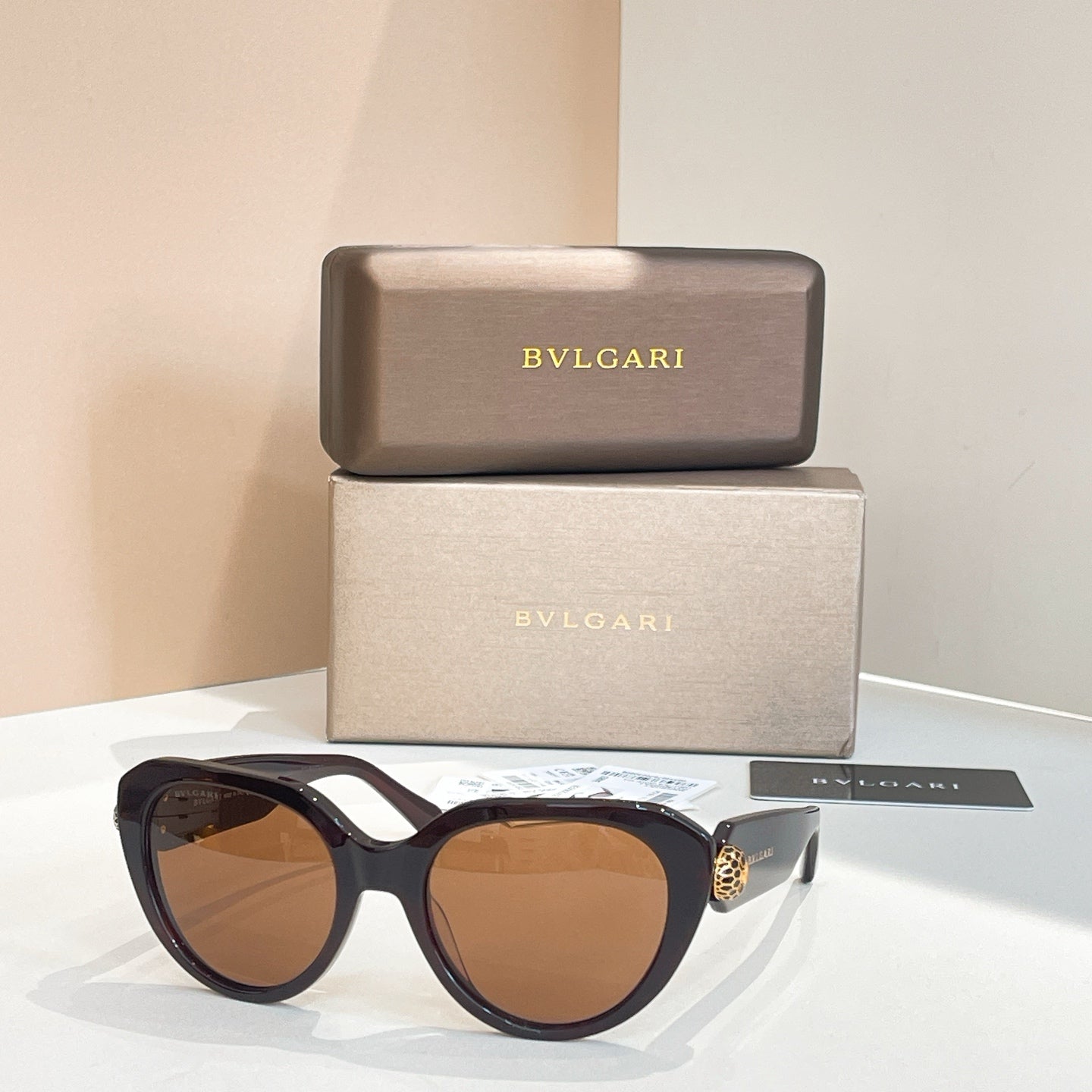 Bvlgari round sunglasses with amber-brown lenses and dark tortoiseshell frames