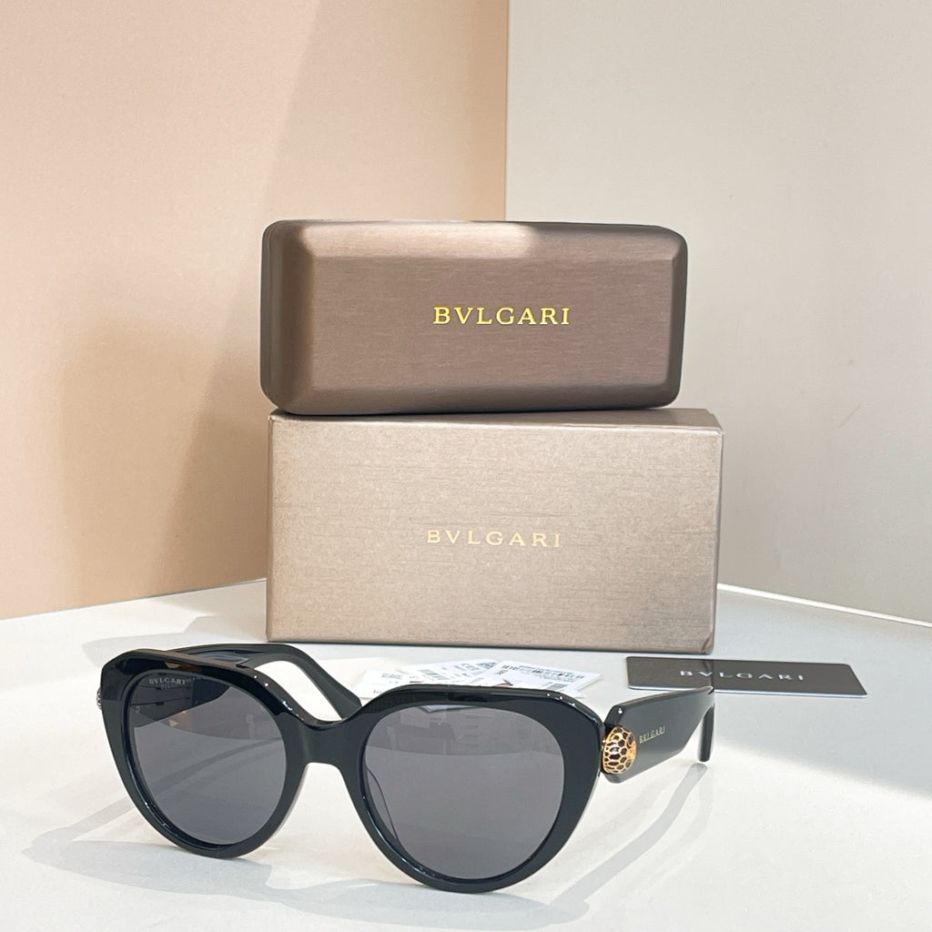 Bvlgari round sunglasses with dark gray lenses and black frames, gold side detail