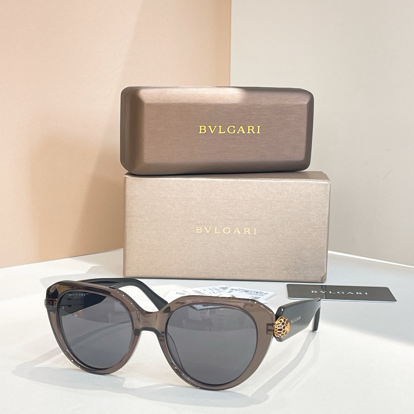 Bvlgari round sunglasses with gray-blue lenses and dark gunmetal frames