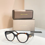 Bvlgari round sunglasses with clear lenses and black frames, gold side emblem