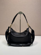Prada black leather hobo shoulder bag with top handles, gold-tone hardware, and feet.