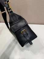 Prada black leather crossbody pouch with gold buckle and small flap pocket.