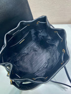 Prada dark blue leather mini bag interior view with drawstring rim and stitched lining