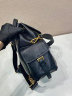 Prada dark blue mini backpack with flap, chain shoulder strap, and front buckle pocket