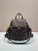Leather mini backpack with flap front, gold-tone logo, and adjustable shoulder straps