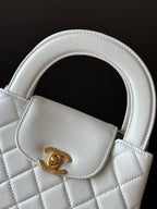 Chanel quilted mini handbag white, curved handle and gold CC clasp
