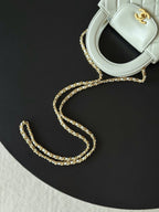 Chanel quilted mini handbag white with gold chain strap detail