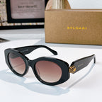 Bvlgari sunglasses with black frame and rose tinted lenses