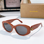 Bvlgari sunglasses with terracotta frame and gray tinted lenses