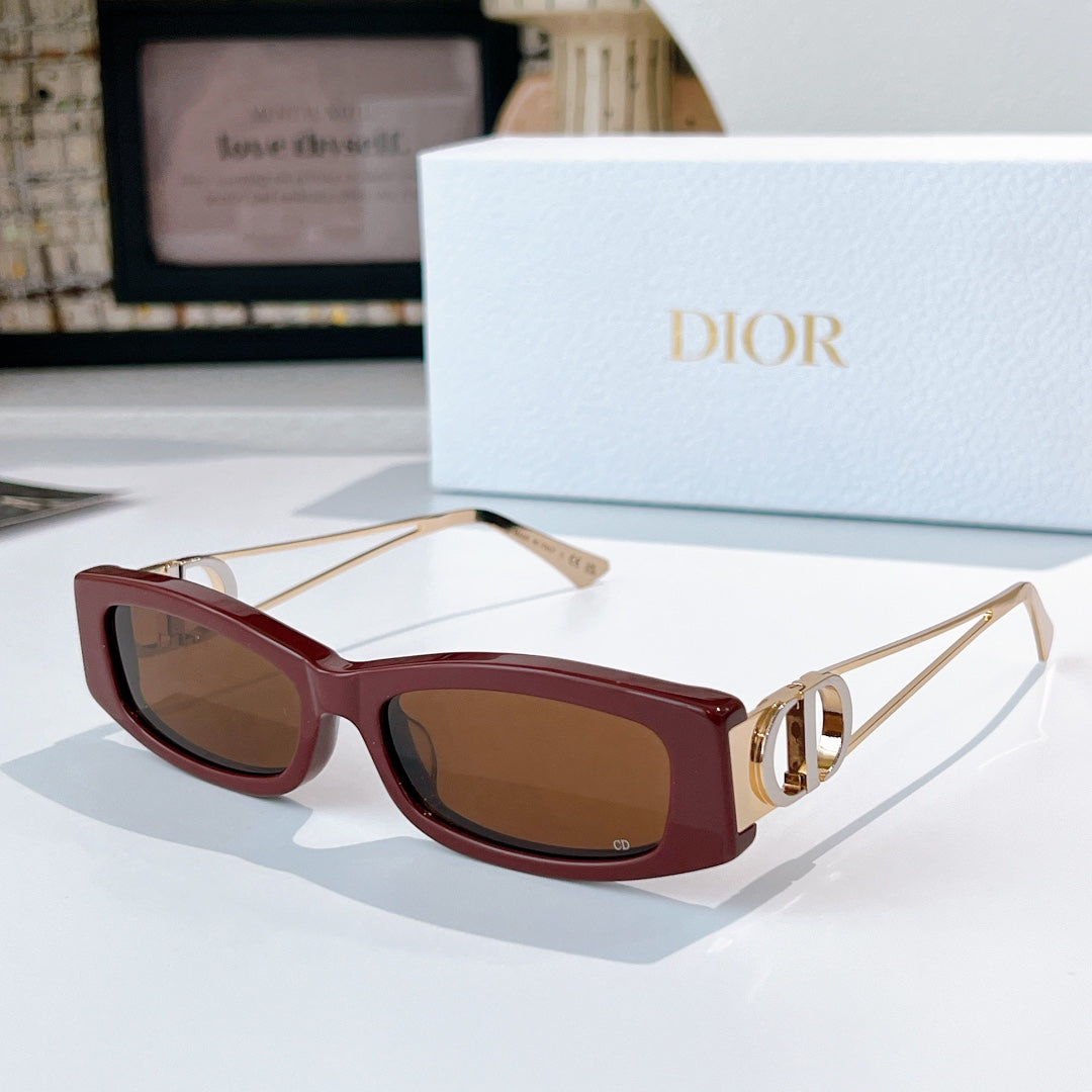 Dior sunglasses, burgundy frame with gold-tone details and brown-tinted lenses