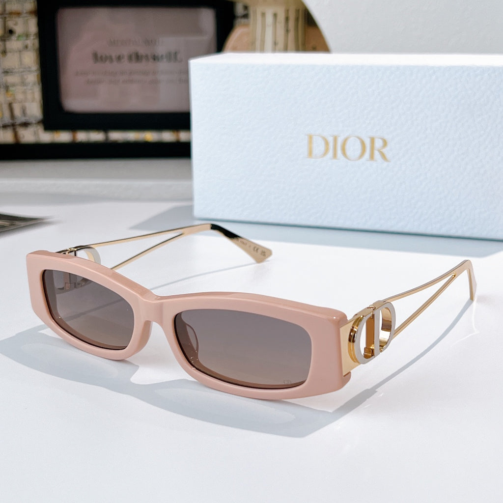 Dior sunglasses, blush pink frame with gold-tone details and tinted lenses