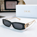 Dior sunglasses, black acetate frame with gold-tone hinges and dark lenses