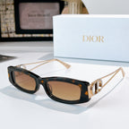 Dior sunglasses, dark tortoiseshell frame with gold-tone details and brown lenses