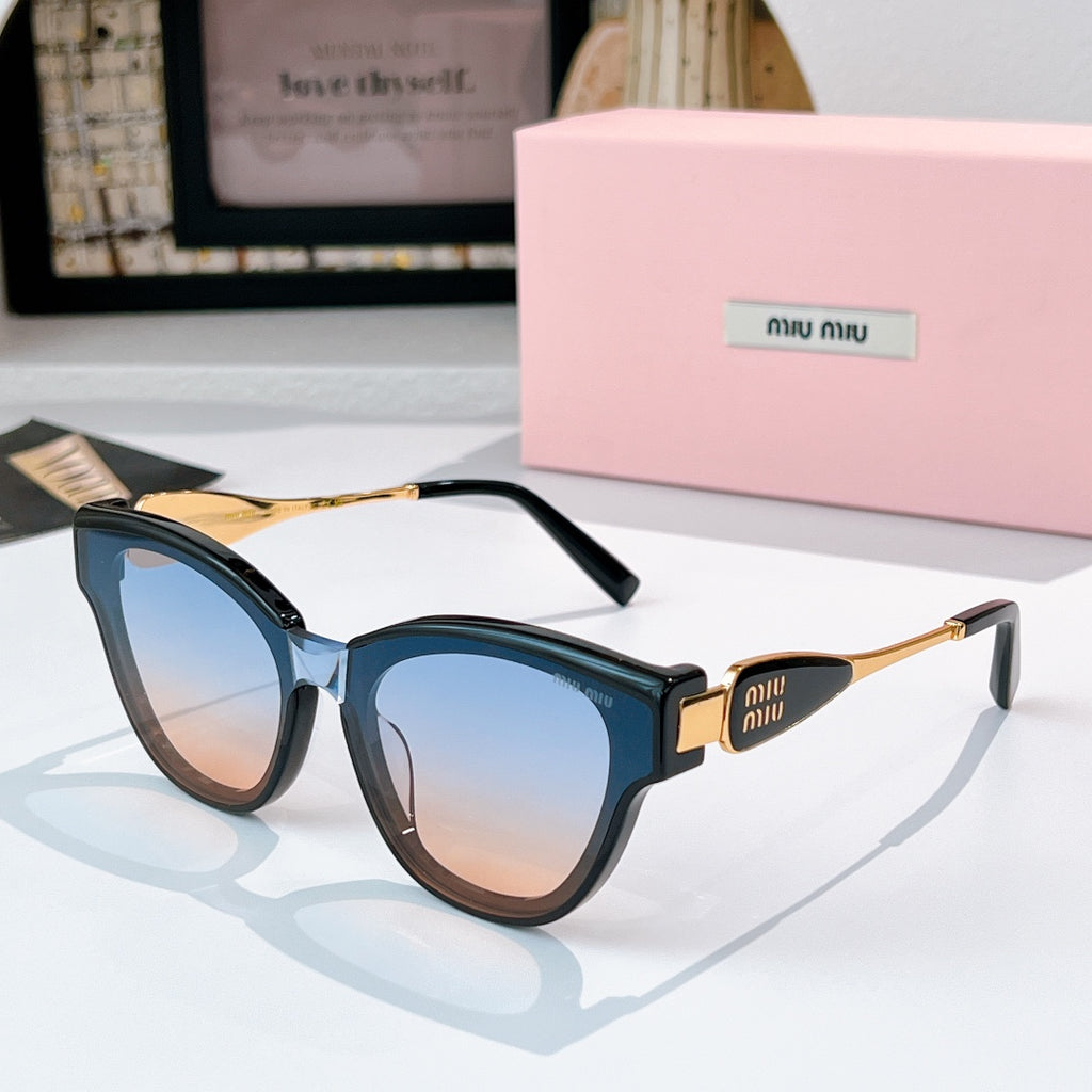MiuMiu cat-eye sunglasses with dark blue frames and gold-tone temples, tinted lenses