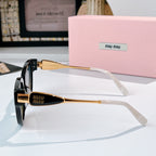 MiuMiu cat-eye sunglasses side view with gold-tone hinge and tinted lenses