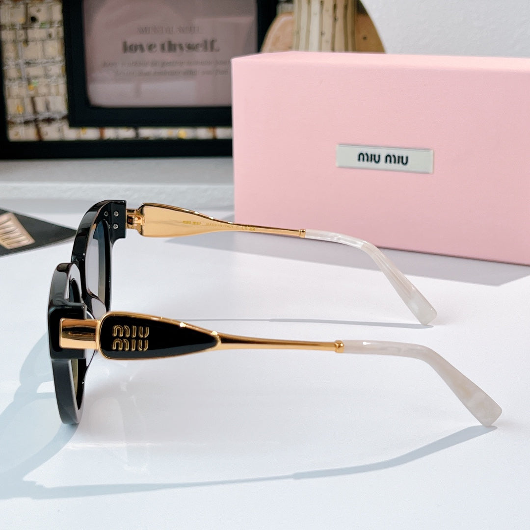 MiuMiu cat-eye sunglasses side view with gold-tone hinge and tinted lenses