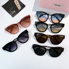 MiuMiu sunglasses assortment with pink, black, brown, and dark blue frames, tinted lenses