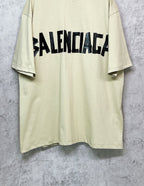 Balenciaga short-sleeve T-shirt, pale yellow with black logo across chest