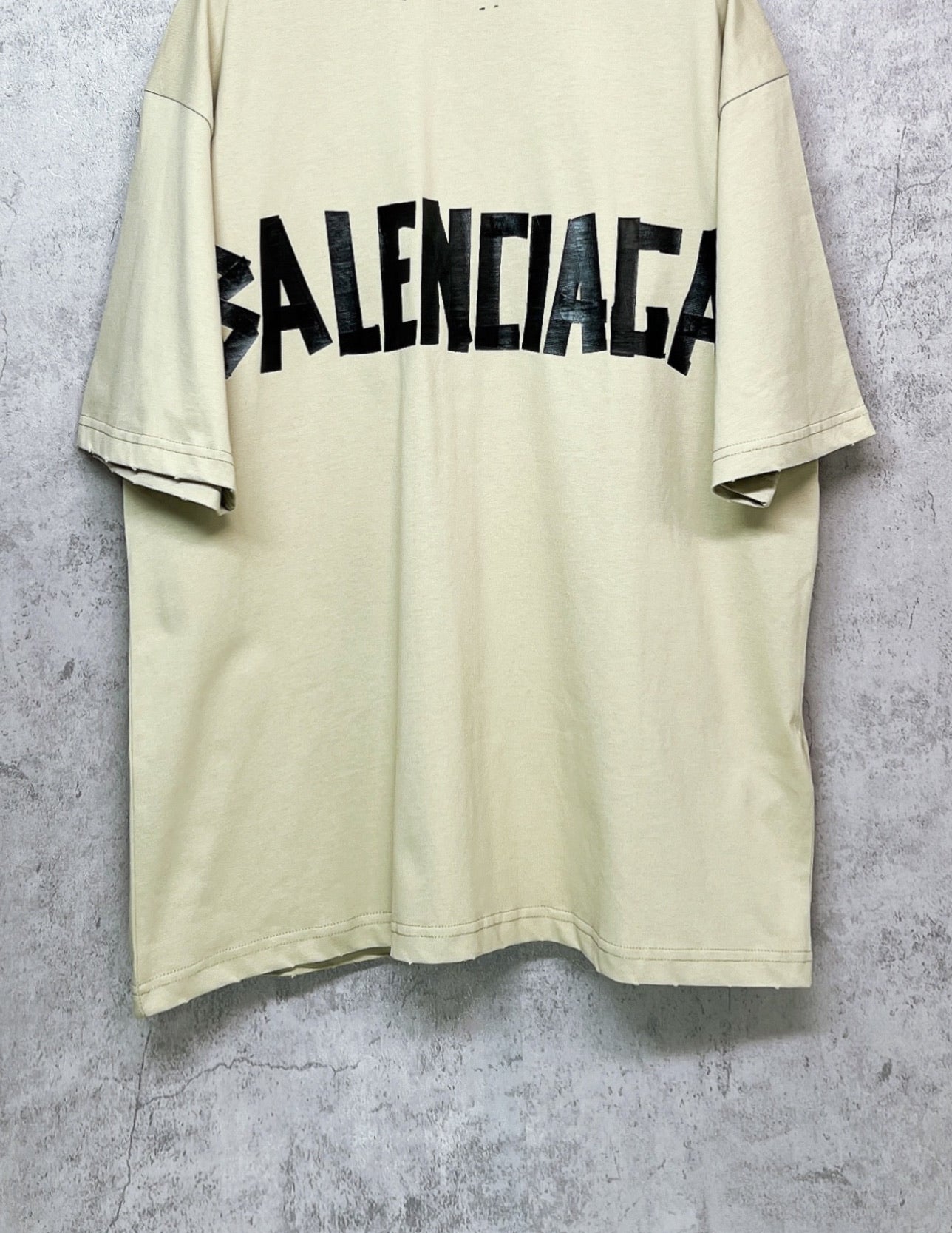 Balenciaga short-sleeve T-shirt, pale yellow with black logo across chest