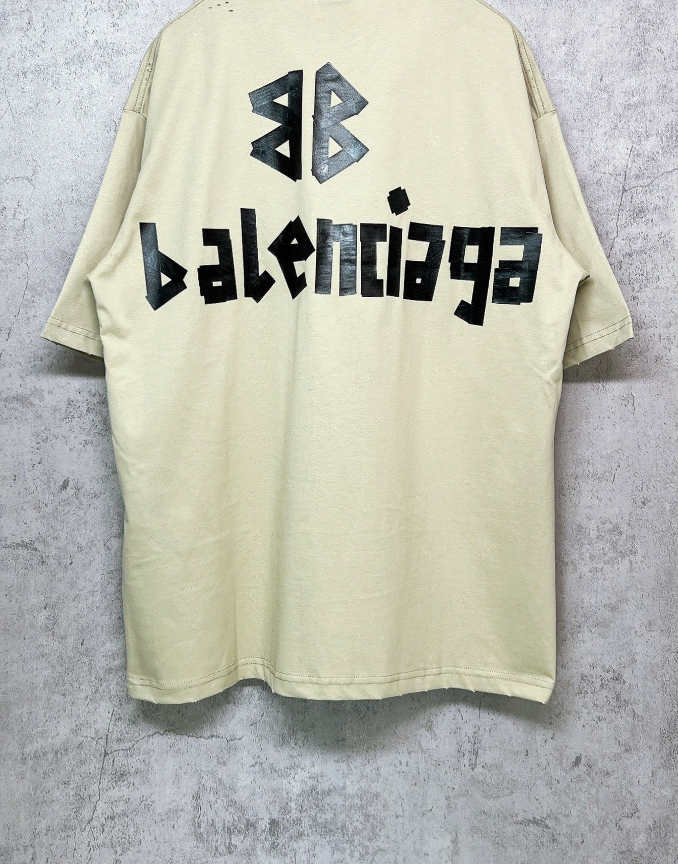 Balenciaga short-sleeve T-shirt, pale yellow with black back logo text