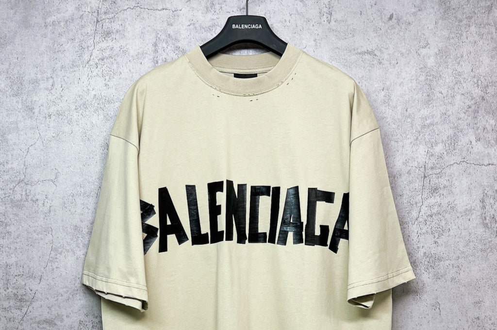 Balenciaga short-sleeve T-shirt, pale yellow with black logo on chest