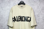 Balenciaga short-sleeve T-shirt, pale yellow with black logo on chest