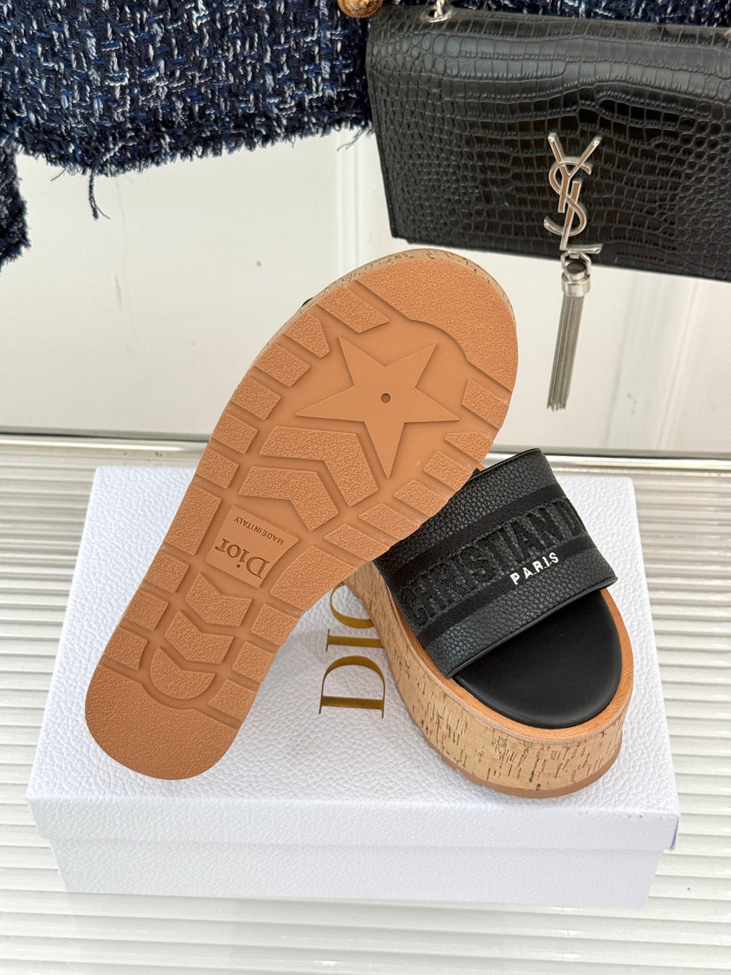 Black platform slide sandal outsole with star tread and cork midsole