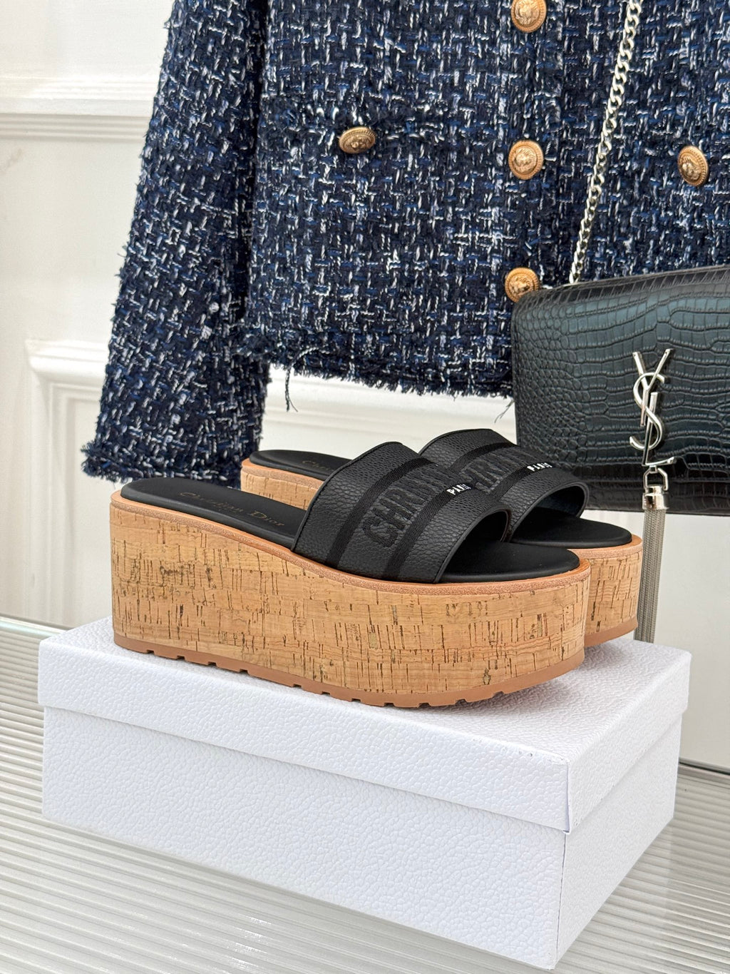 Black platform slide sandals with wide textured straps and cork wedge sole