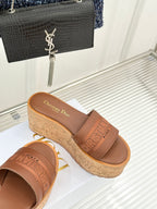Tan cork platform sandals with wide strap and Dior logo footbed, open toe